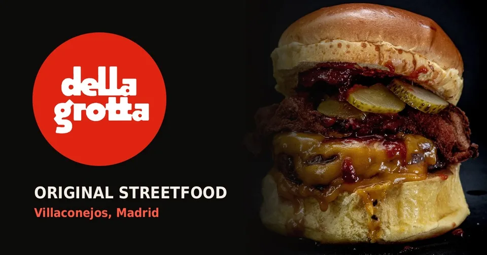 Portada de la web de Della Grotta: logo rojo y una hamburguesa sobre fondo negro